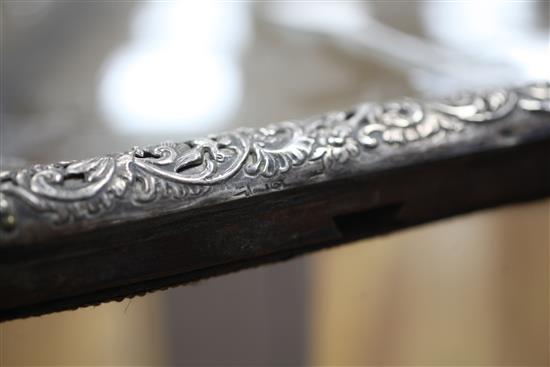 A large antique Dutch repousse silver mounted easel mirror, 26.5in.